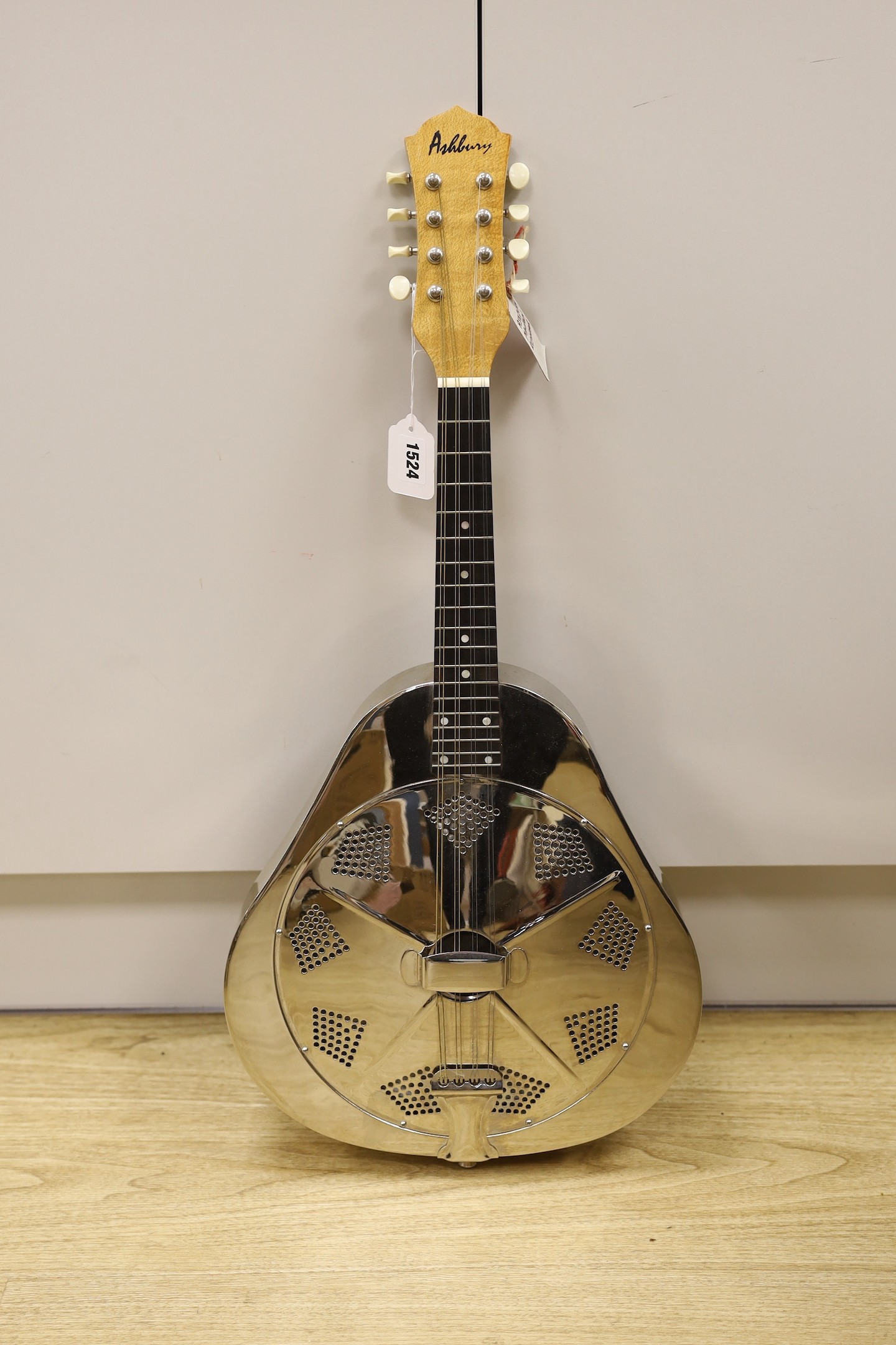 An Ashbury mandolin ‘Resonator’ with fitted, padded case, mandolin 69 cms high.